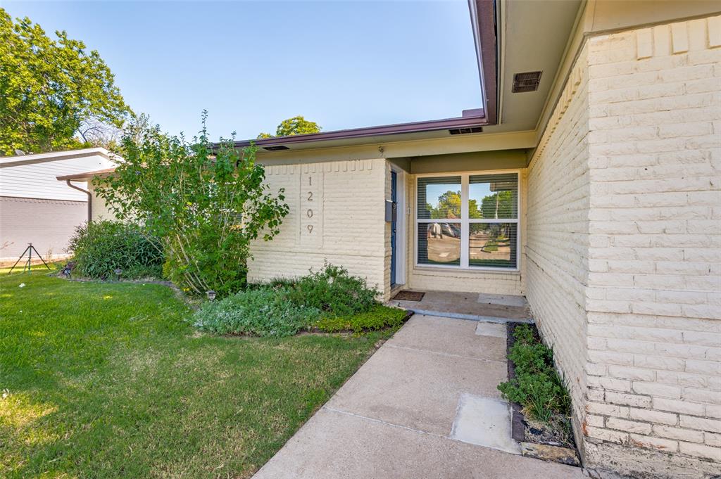 1209 Ridgeway Drive Richardson, TX 75080 - Photo 33 of 33 a front view of a house with garden