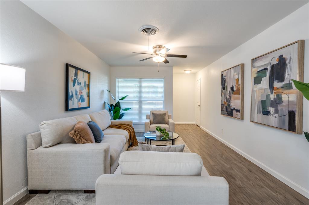 1209 Ridgeway Drive Richardson, TX 75080 - Photo 5 of 33 a living room with furniture and a chandelier
