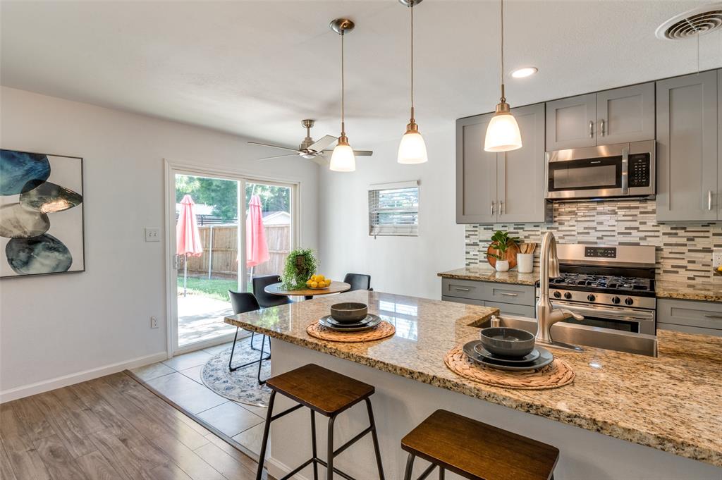1209 Ridgeway Drive Richardson, TX 75080 - Photo 9 of 33 a kitchen with a table and chairs in it
