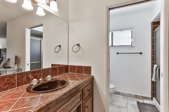 928 Randall Street Ridgecrest, CA 93555 - Photo 28 of 34 a bathroom with a sink and a mirror