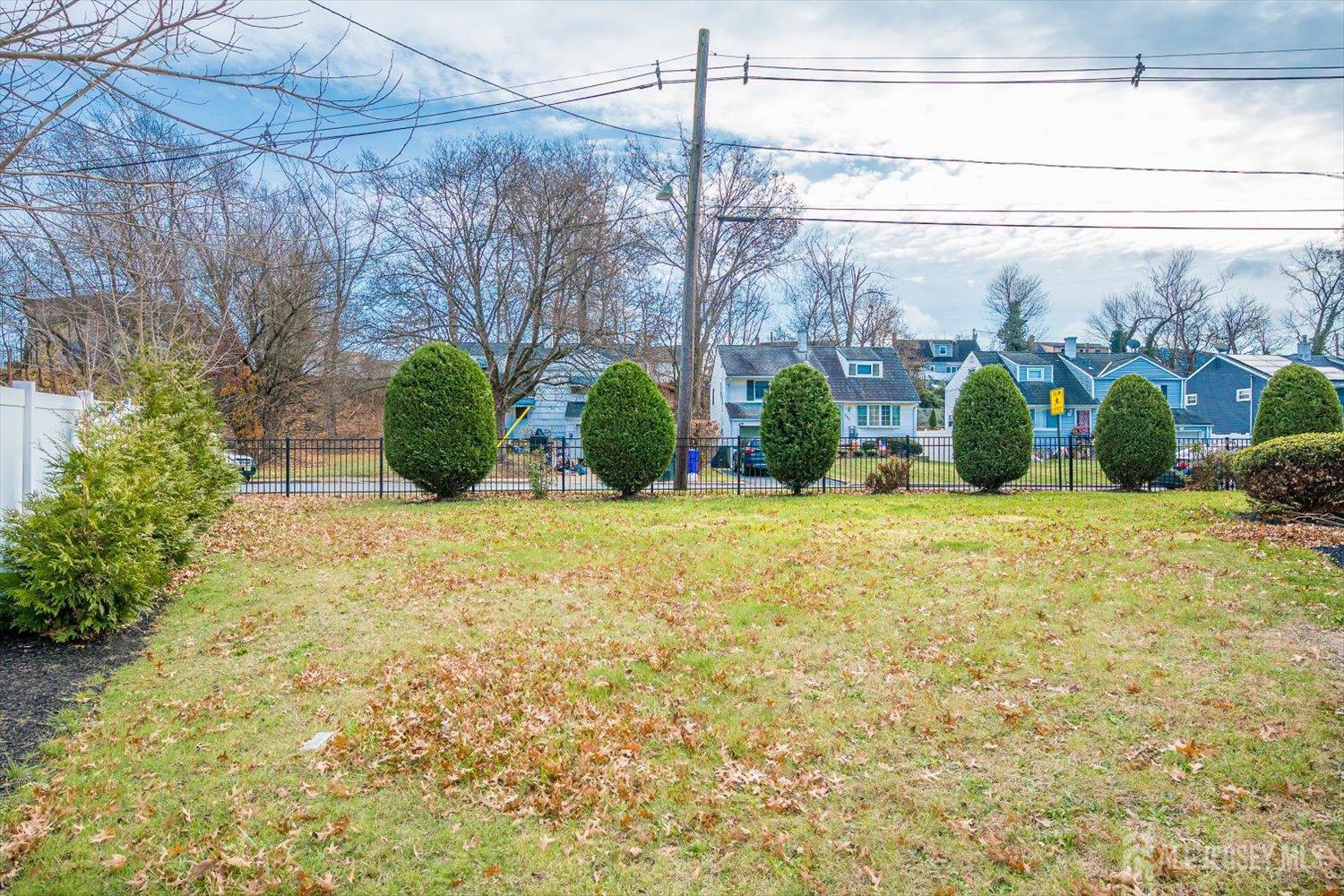 259 McFarlane Road Colonia, NJ 07067 - Photo 44 of 50 a view of a garden with a building in the background