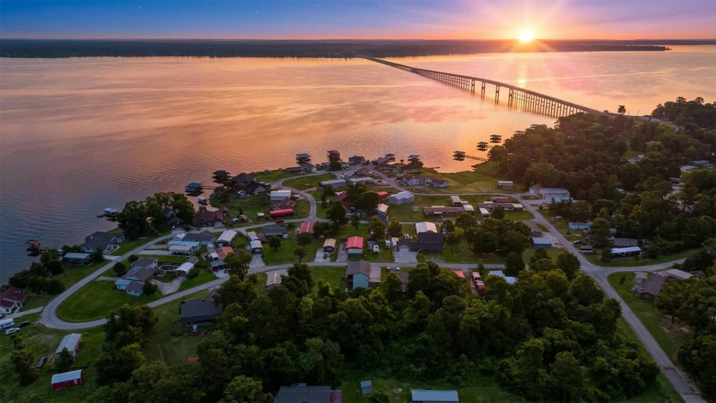 201 Coco Loop Point Blank, TX 77364 - Photo 2 of 41 Amazing Sunset view over the 190 Lake Livingston Bridge