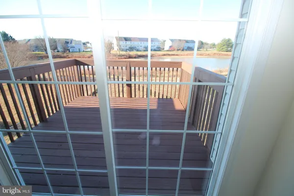 a view of a balcony with a floor to ceiling window