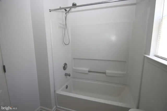 a close view of a bathtub in bathroom