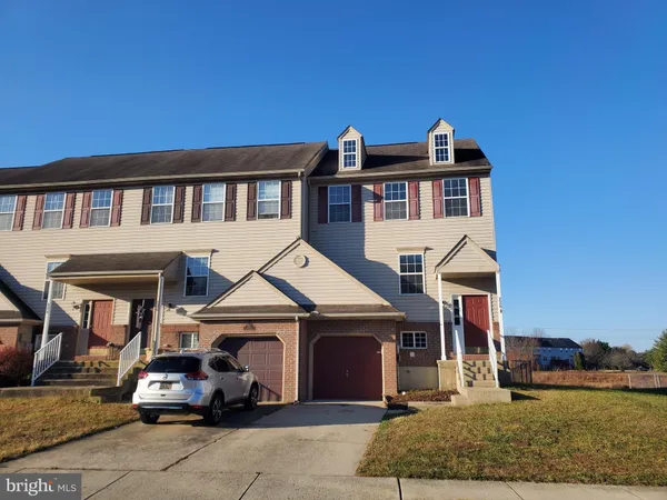 a car parked in front of a house