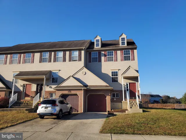 a car parked in front of a house