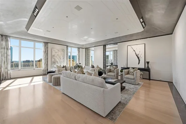 a living room with furniture wooden floor and a fireplace