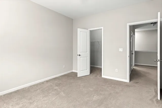 an empty room with closet area