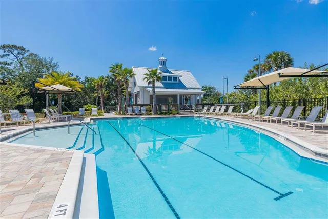 a view of a patio with table and chairs potted plants