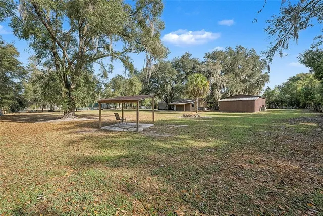 a swimming pool with trees in the background