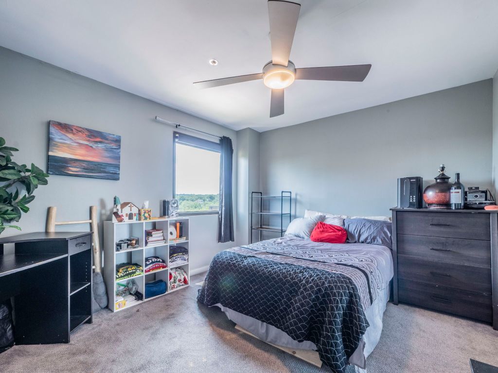 40 North Interstate Highway 35, Unit 4A4 Austin, TX 78701 - Photo 17 of 40 a bedroom with a bed and a window