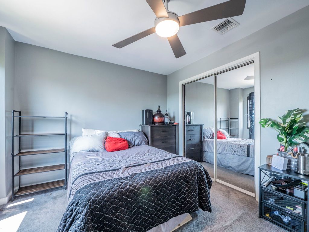 40 North Interstate Highway 35, Unit 4A4 Austin, TX 78701 - Photo 18 of 40 a bedroom with a bed and a potted plant