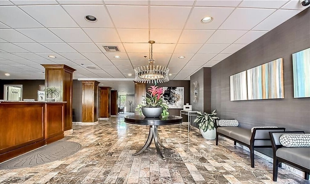 40 North Interstate Highway 35, Unit 4A4 Austin, TX 78701 - Photo 27 of 40 a living room with furniture and a chandelier