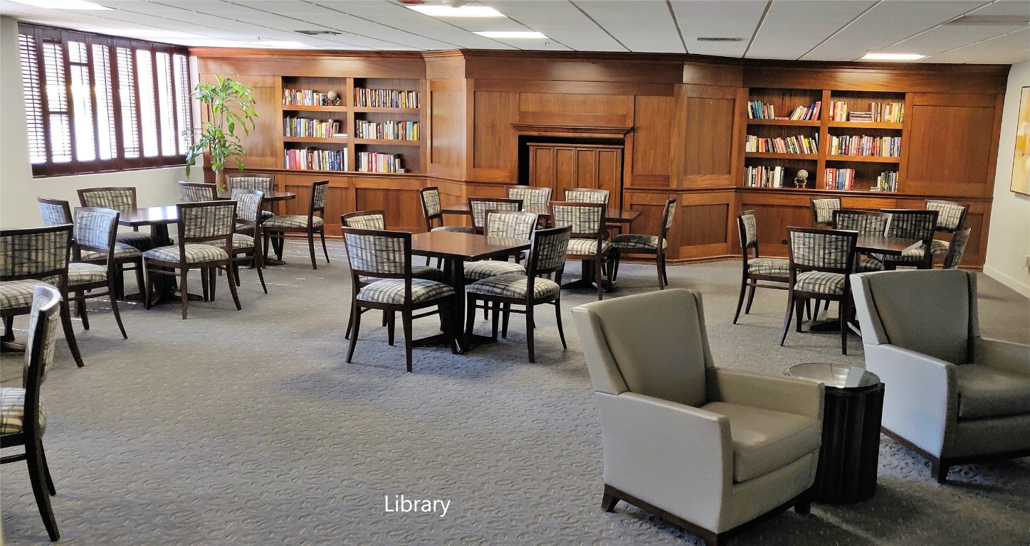 40 North Interstate Highway 35, Unit 4A4 Austin, TX 78701 - Photo 33 of 40 a living room with furniture a bookshelf and a window