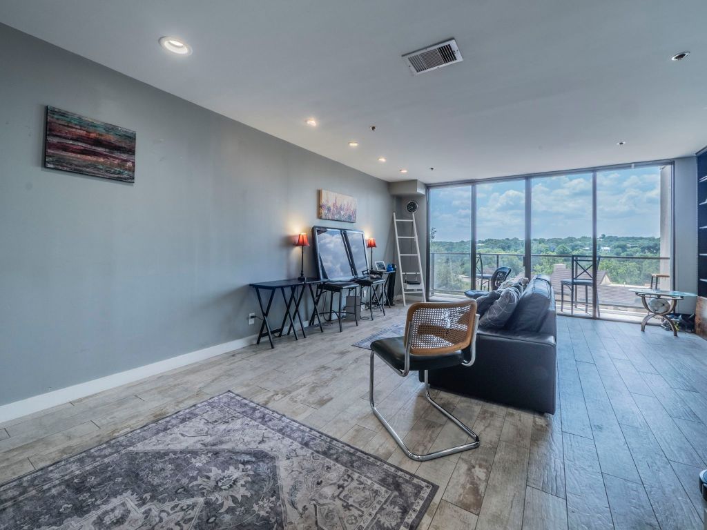 40 North Interstate Highway 35, Unit 4A4 Austin, TX 78701 - Photo 3 of 40 a living room with furniture and a large window