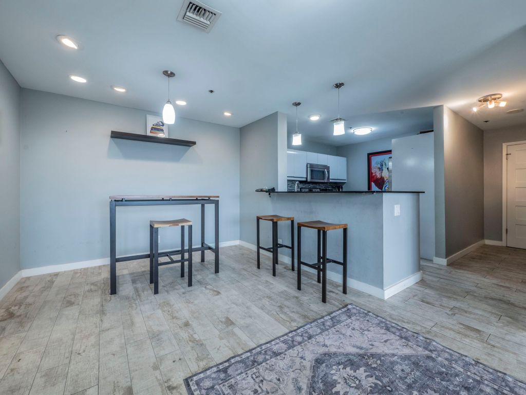 40 North Interstate Highway 35, Unit 4A4 Austin, TX 78701 - Photo 6 of 40 a view of kitchen with cabinets and wooden floor