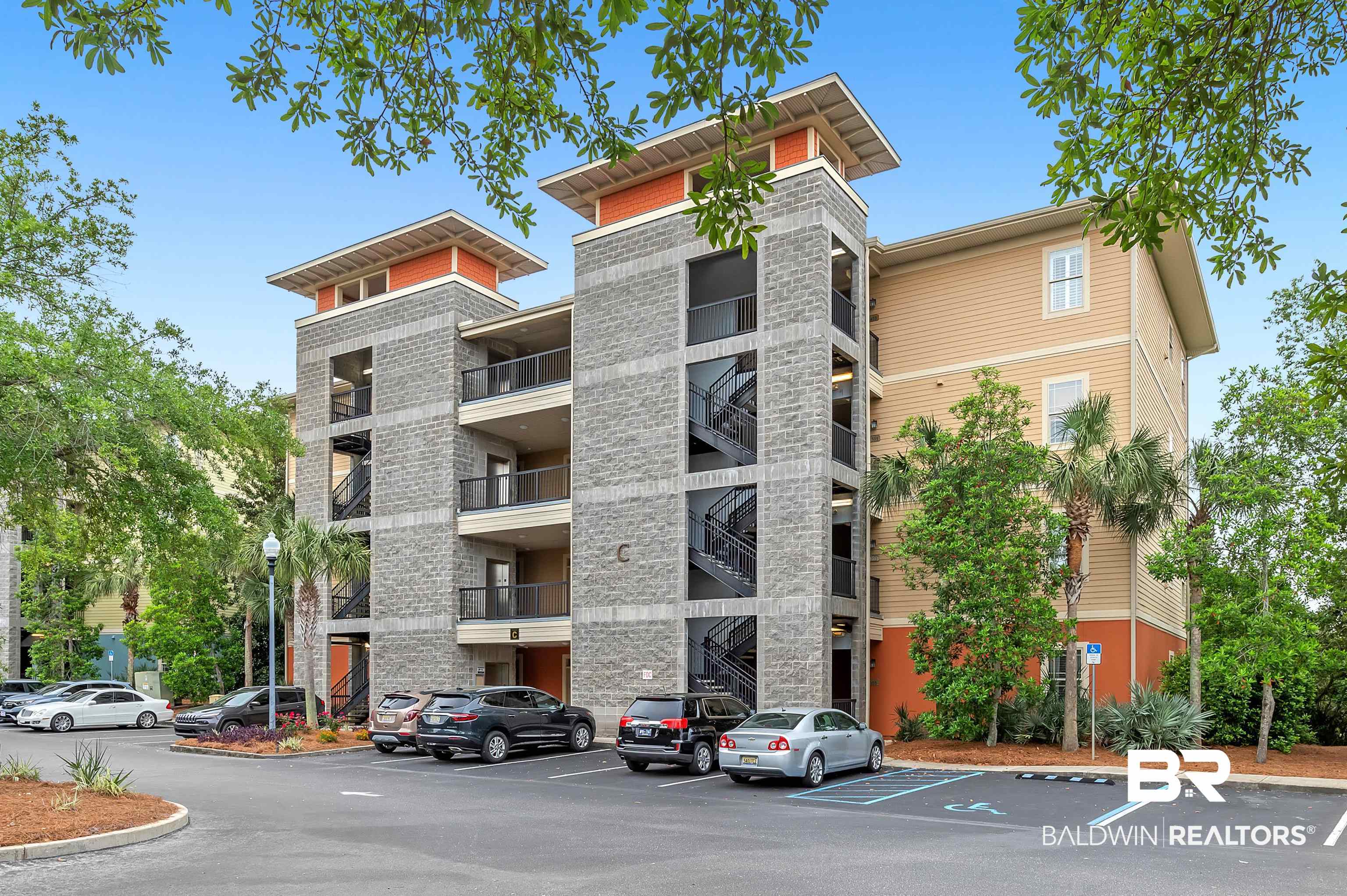 1430 Regency Road, Unit C201 Gulf Shores, AL 36542 - Photo 1 of 54 View of apartment building / complex with uncovered parking