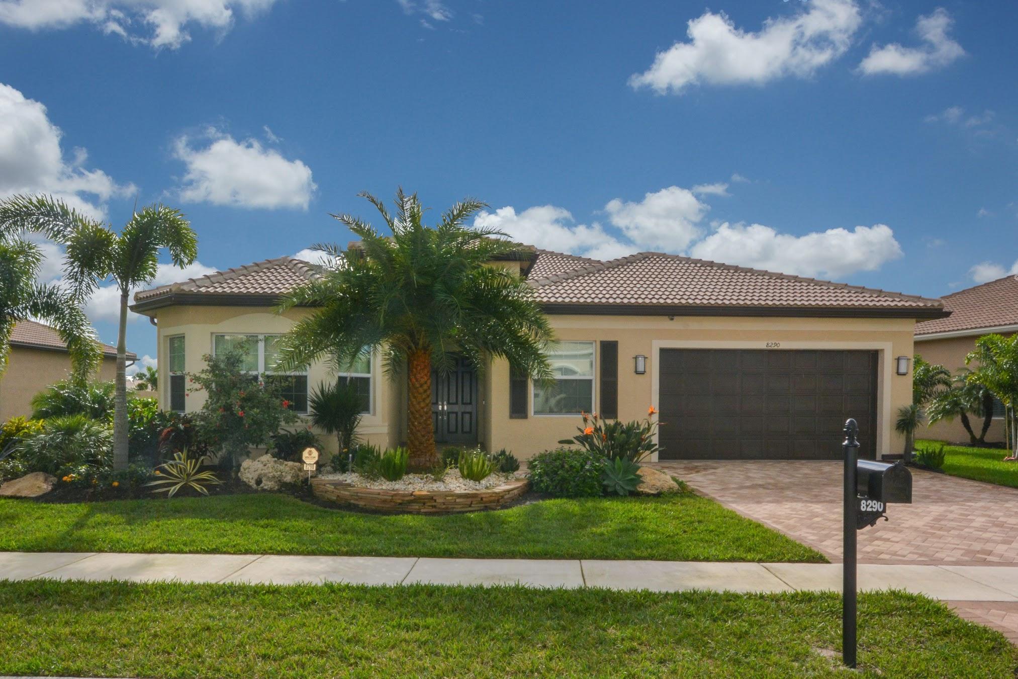 8290 Razorback Court Boynton Beach, FL 33473 - Photo 2 of 67 Lushly Landscaped Exterior