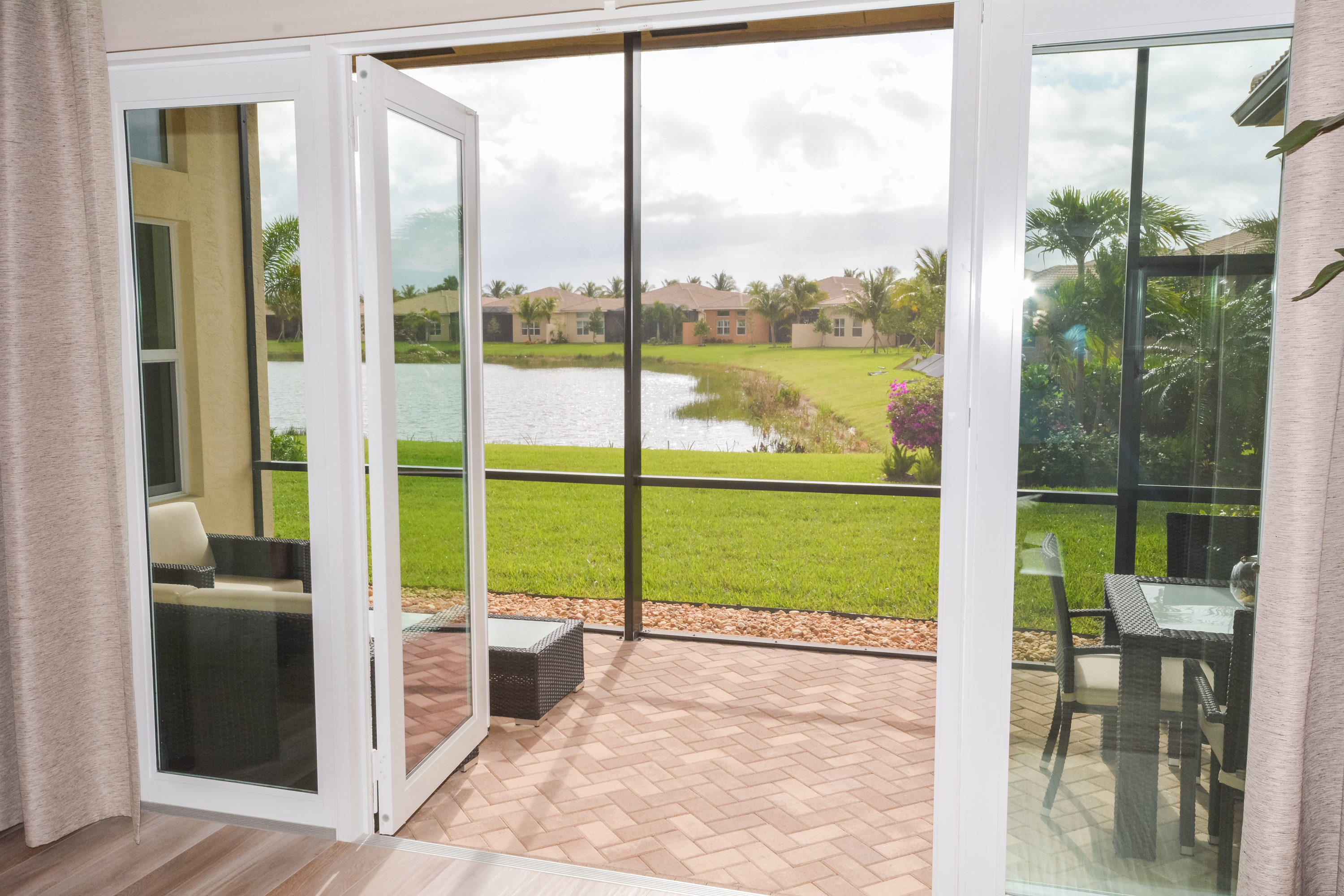 8290 Razorback Court Boynton Beach, FL 33473 - Photo 37 of 67 French Doors Lead To Screened Porch