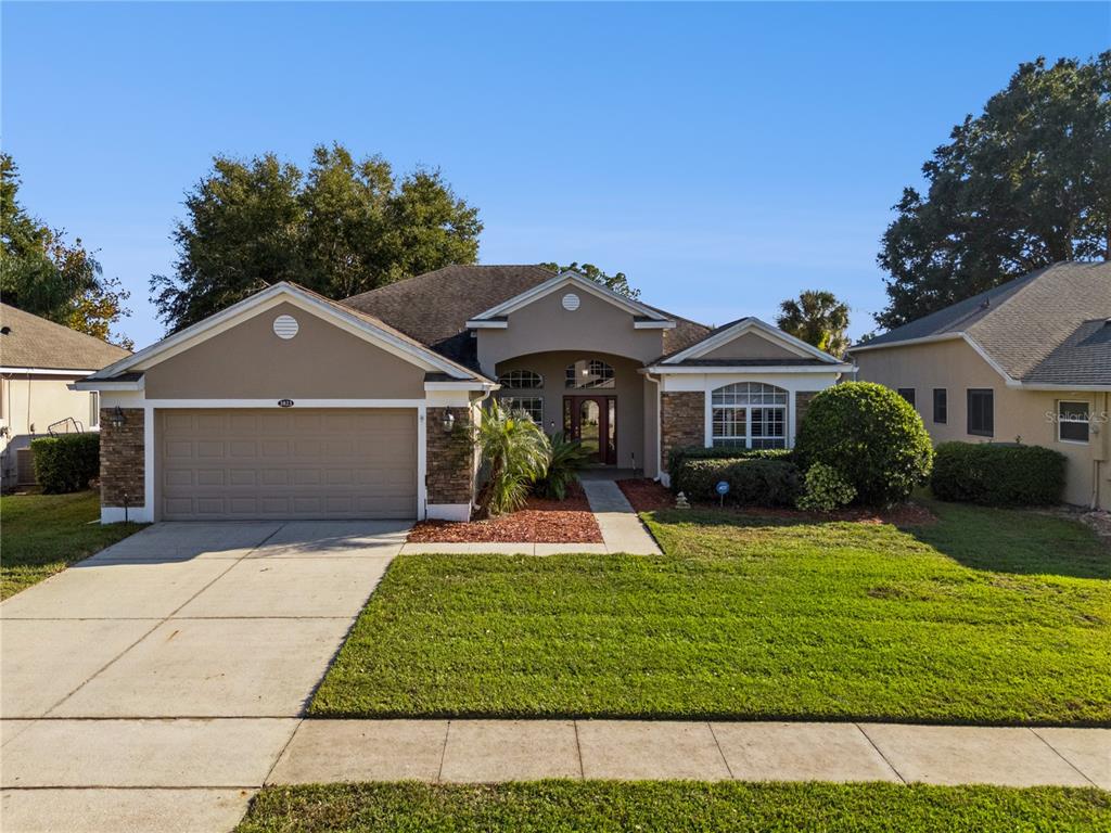 3823 Beacon Ridge Way Clermont, FL 34711 - Photo 1 of 57 a front view of a house with a yard