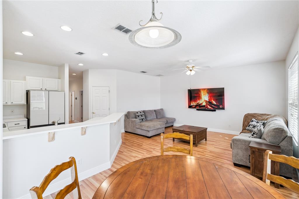 3823 Beacon Ridge Way Clermont, FL 34711 - Photo 14 of 57 a living room with furniture and kitchen view