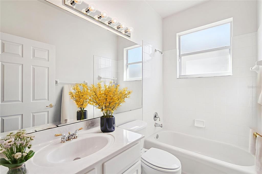 3823 Beacon Ridge Way Clermont, FL 34711 - Photo 20 of 57 a bathroom with a sink toilet and shower