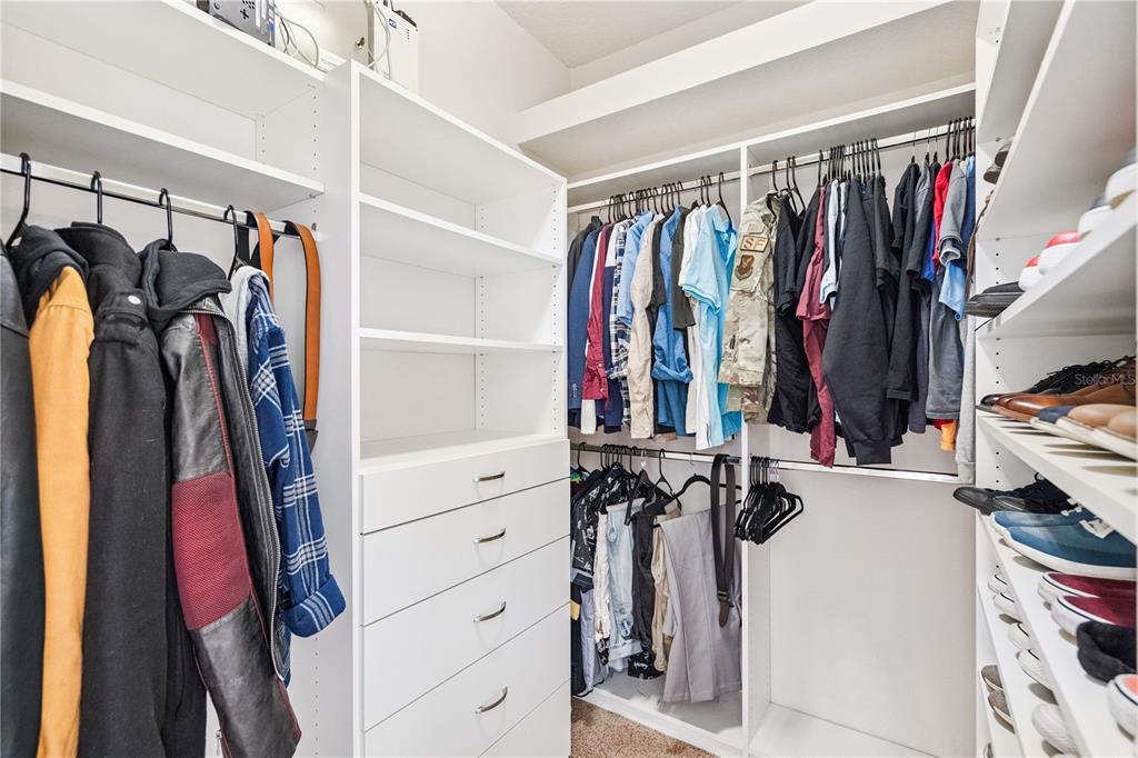 3823 Beacon Ridge Way Clermont, FL 34711 - Photo 35 of 57 a view of walk in closet with clothes