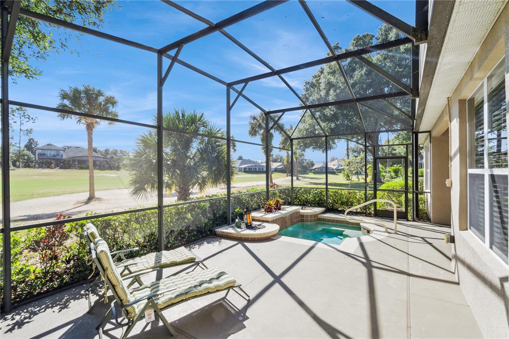 3823 Beacon Ridge Way Clermont, FL 34711 - Photo 38 of 57 a building outdoor space with patio furniture and garden