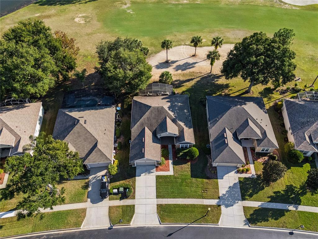 3823 Beacon Ridge Way Clermont, FL 34711 - Photo 41 of 57 an aerial view of residential houses with outdoor space and ocean view