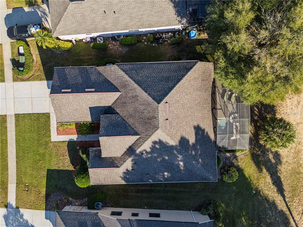 3823 Beacon Ridge Way Clermont, FL 34711 - Photo 42 of 57 an aerial view of a house with a yard