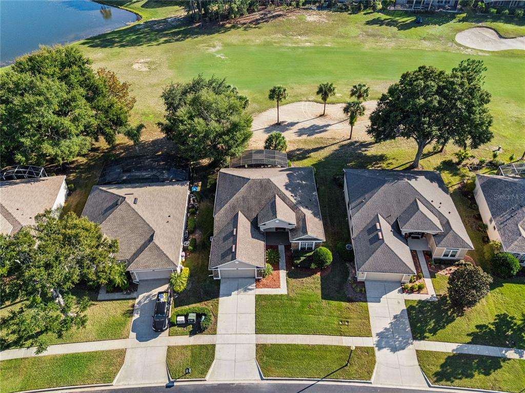 3823 Beacon Ridge Way Clermont, FL 34711 - Photo 46 of 57 an aerial view of residential houses with outdoor space and swimming pool