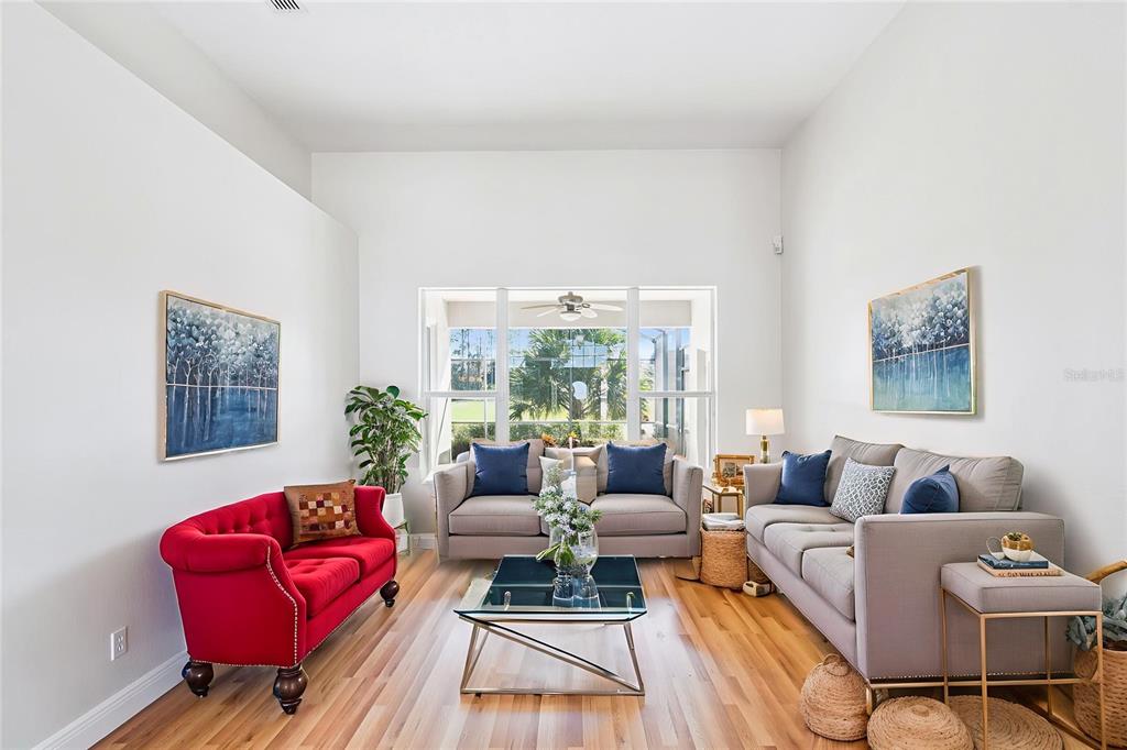 3823 Beacon Ridge Way Clermont, FL 34711 - Photo 10 of 57 a living room with furniture and a large window