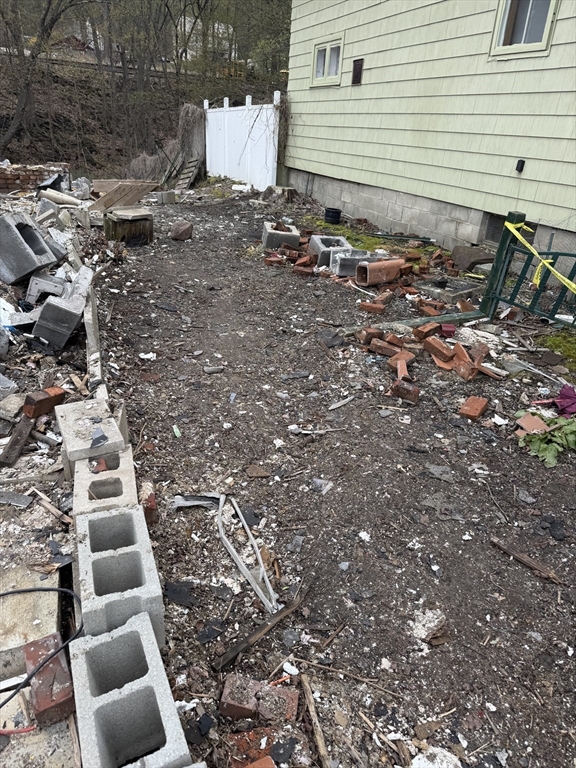 77 Washington Street Greenfield, MA 01301 - Photo 2 of 7 a view of a backyard with chairs
