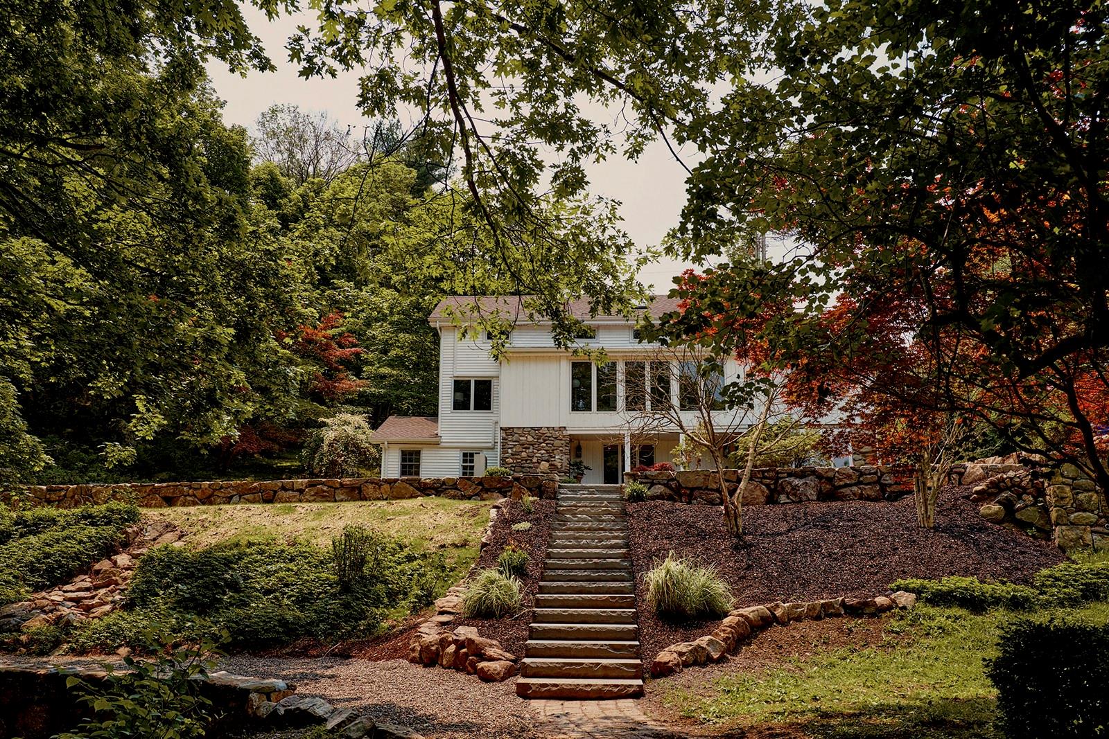 a front view of a house with a yard