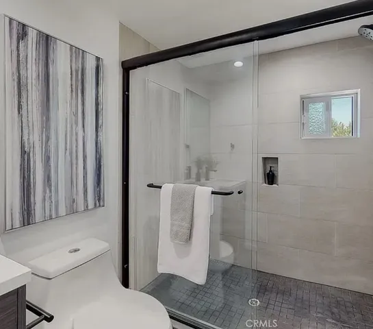 a bathroom with a shower and a toilet
