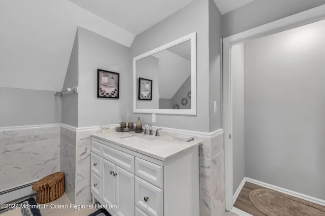 a bathroom with a sink a vanity and a mirror
