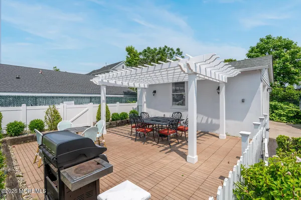 a patio with table and chairs