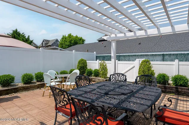 a view of an outdoor dining space with a patio