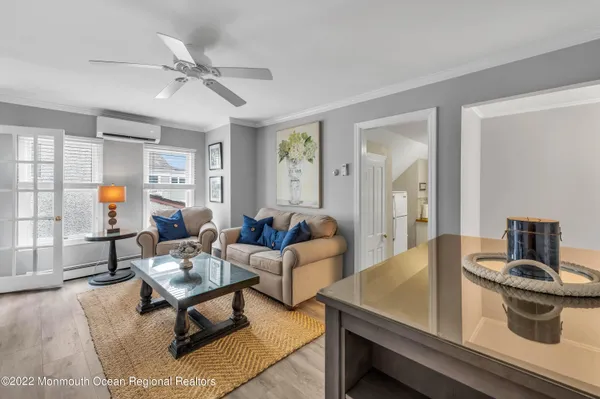 a living room with furniture and a sink