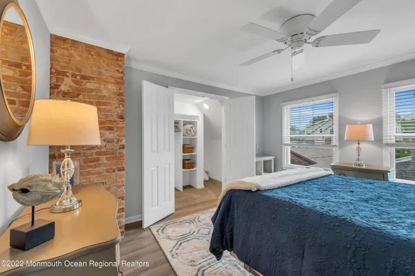a bedroom with a bed and a lamp on table