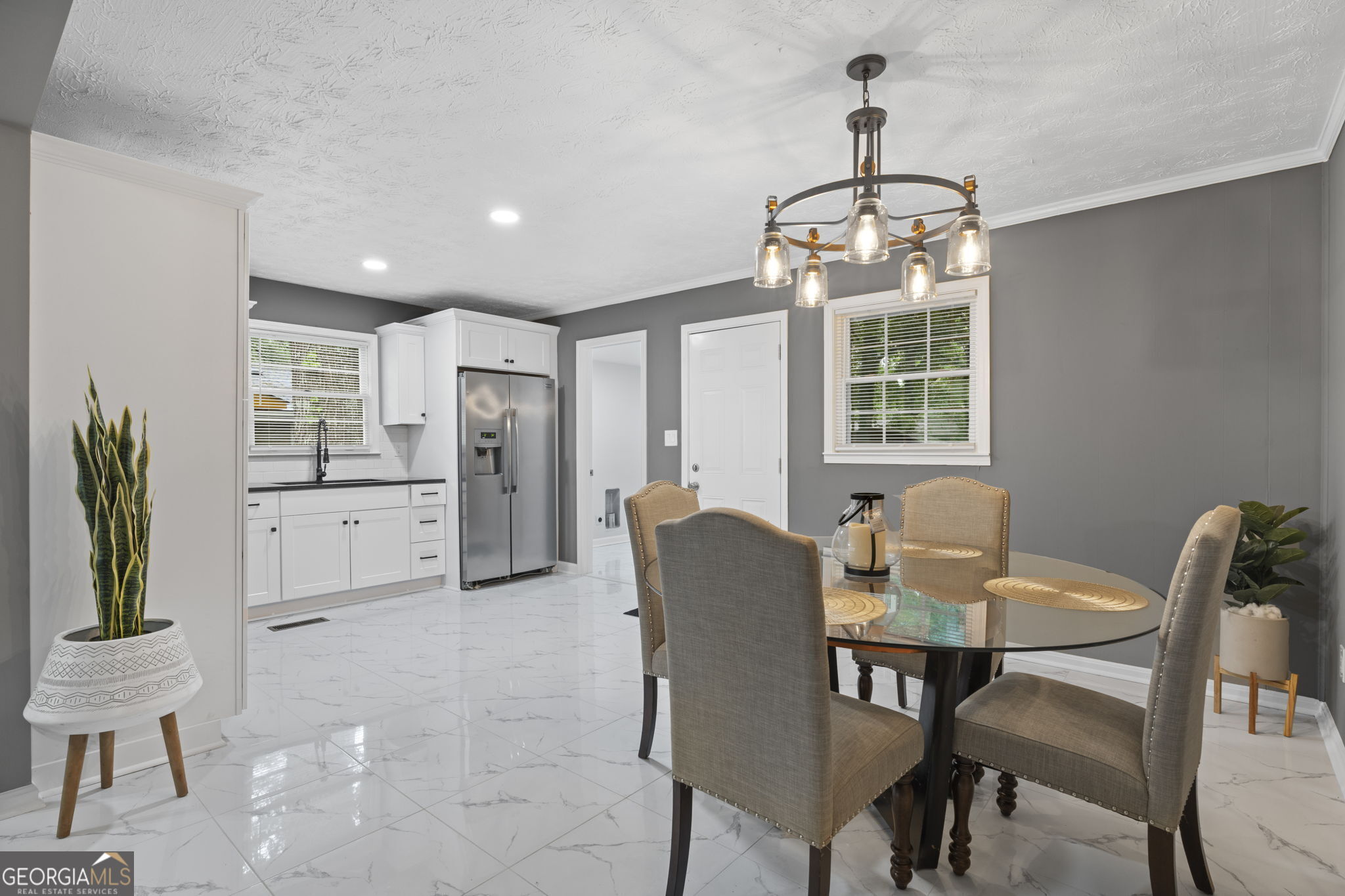 3567 Forrest Park Road Southeast Atlanta, GA 30354 - Photo 9 of 29 a dining room with furniture a chandelier and window