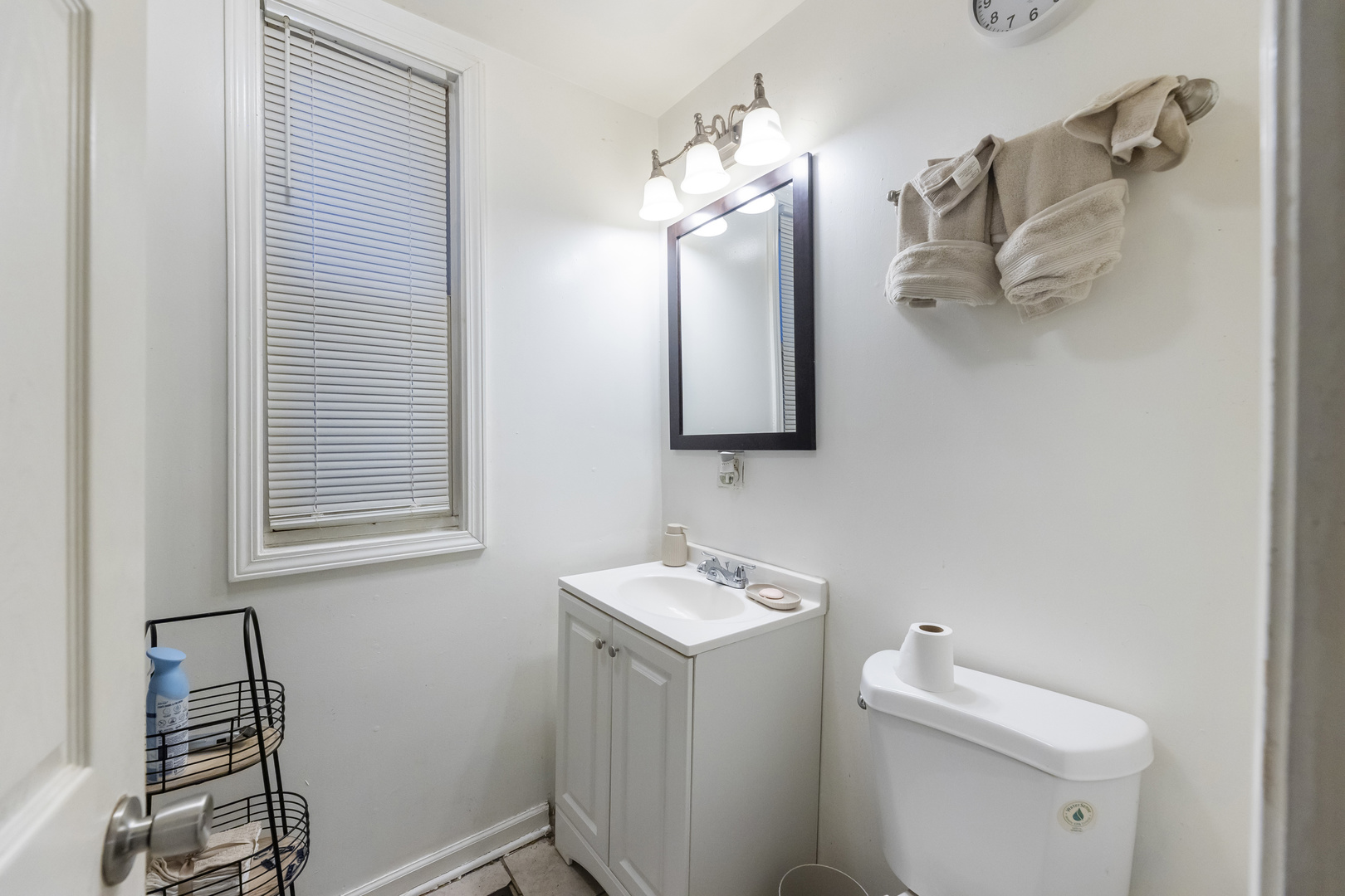 6601 South St Lawrence Avenue Chicago, IL 60637 - Photo 15 of 29 a bathroom with a toilet sink and mirror