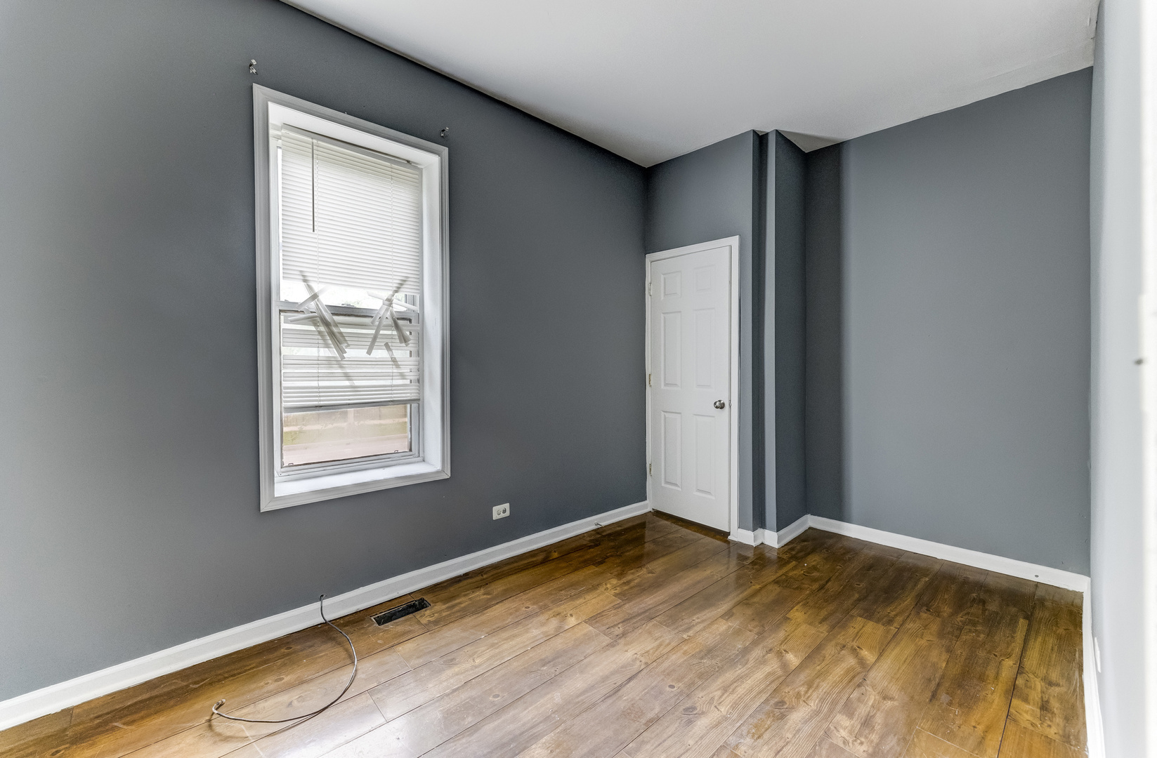 6601 South St Lawrence Avenue Chicago, IL 60637 - Photo 9 of 29 a view of a room with wooden floor and windows