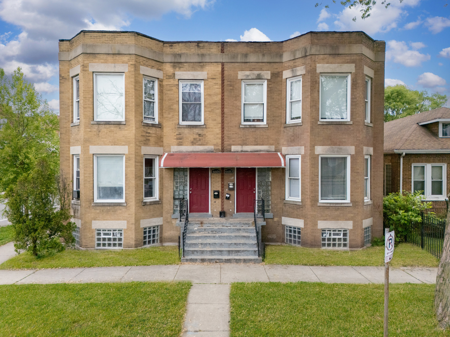 6601 South St Lawrence Avenue Chicago, IL 60637 - Photo 10 of 29 a front view of a house having yard