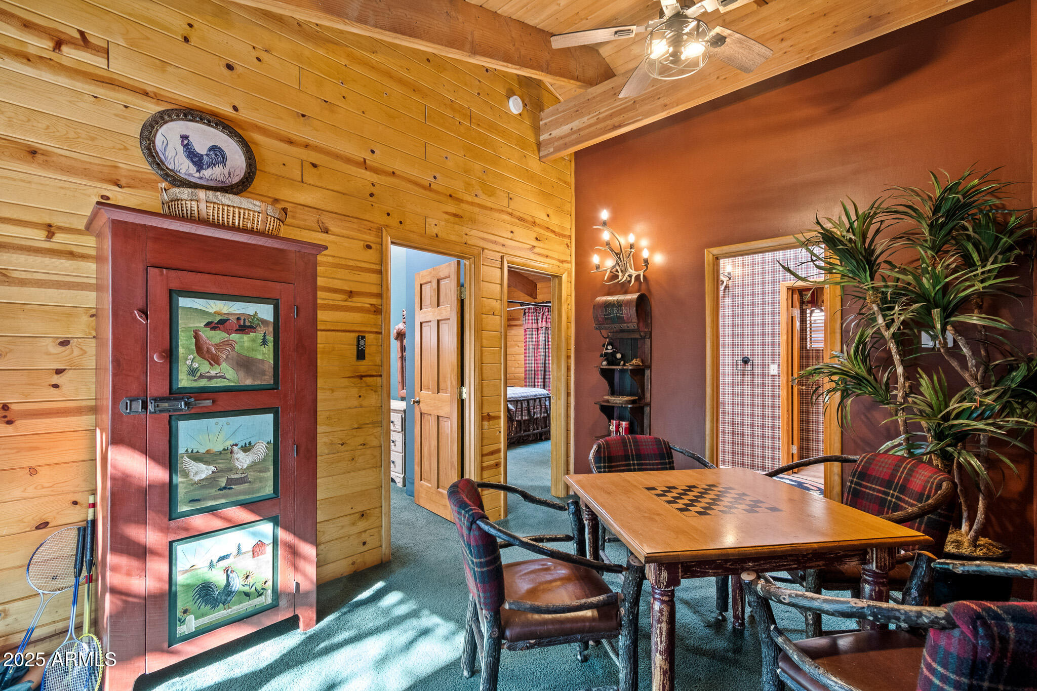 2948 Wildcat Trail Overgaard, AZ 85933 - Photo 15 of 38 a dining room with a table and chairs