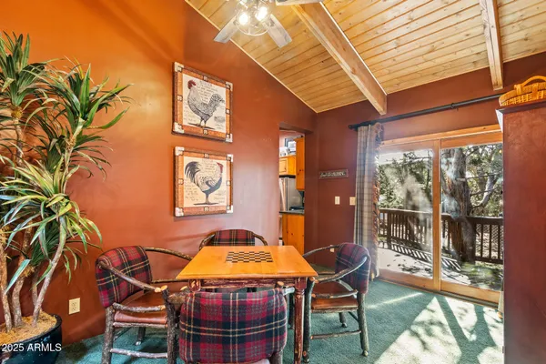 a dining room with a table and chairs
