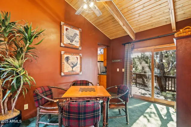 a dining room with a table and chairs