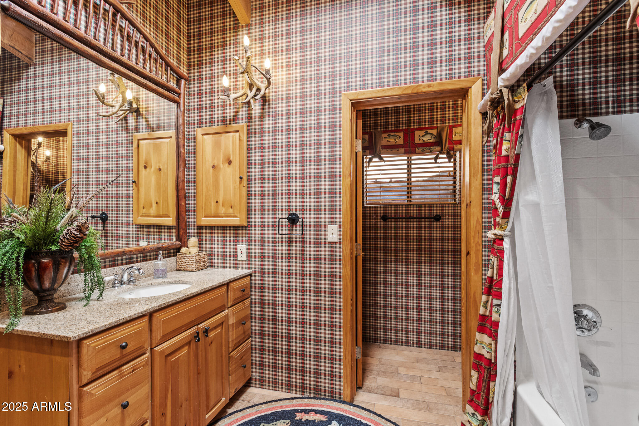 2948 Wildcat Trail Overgaard, AZ 85933 - Photo 18 of 38 a bathroom with a sink and a mirror