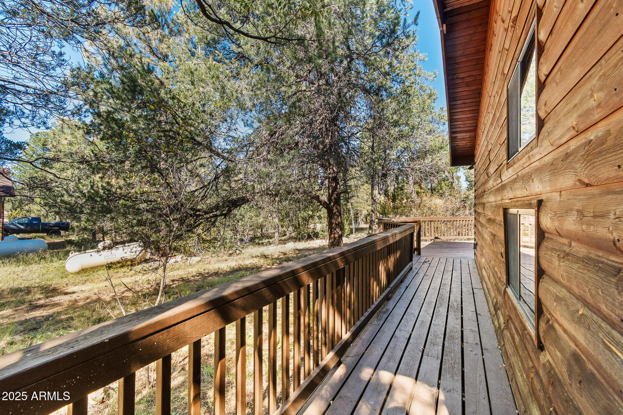 2948 Wildcat Trail Overgaard, AZ 85933 - Photo 25 of 38 a view of balcony with wooden floor and fence and a bench