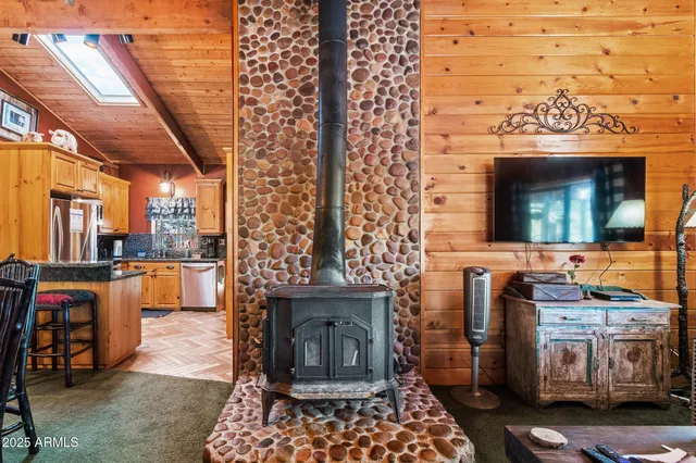 a living room with furniture a fireplace and a table